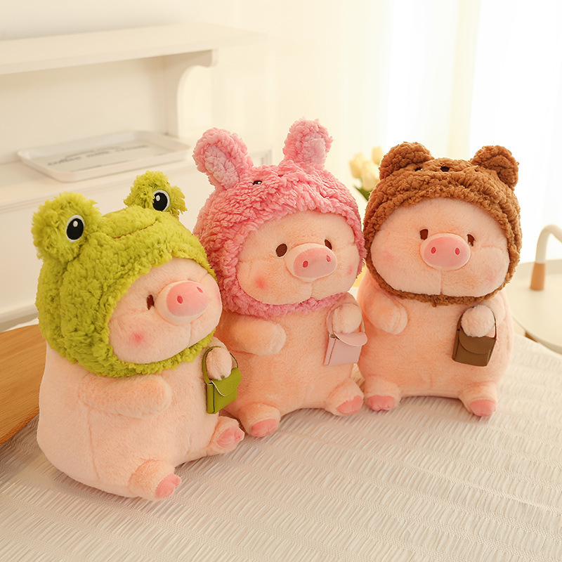 Pig plush toy in animal costume shown in angled view with frog, rabbit, and bear styles, soft plush fabric and compact shape ideal for hugging, display, and everyday comfort