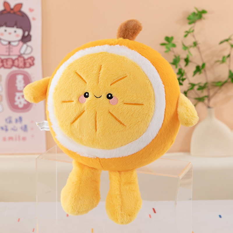 Orange plush pillow displayed on a clear stand, featuring a round fruit design with smiling face, soft texture for cozy decor and everyday comfort