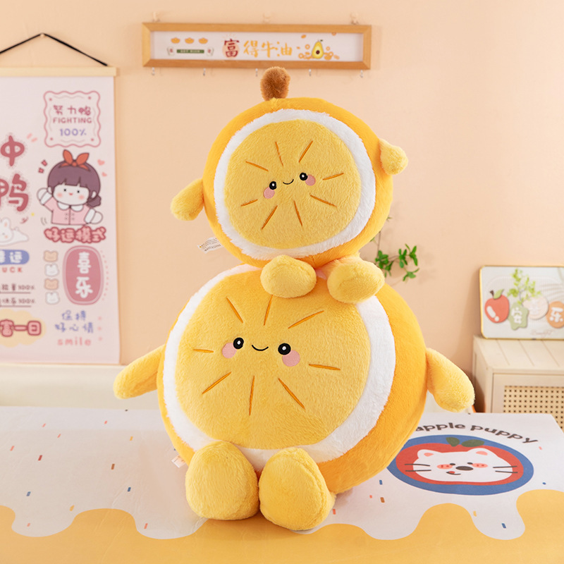 Orange plush pillows stacked in two sizes, featuring cute smiling design and soft texture, cozy cushions for home decor and relaxing use