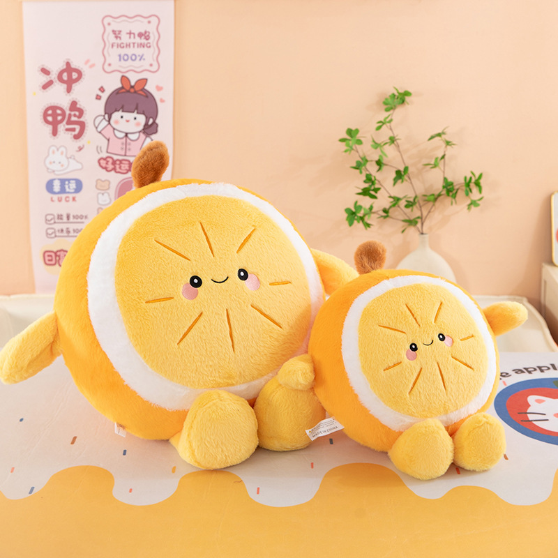 Orange plush pillows in two size options displayed side by side, soft round cushions with smiling face for hugging, relaxing, and home decor
