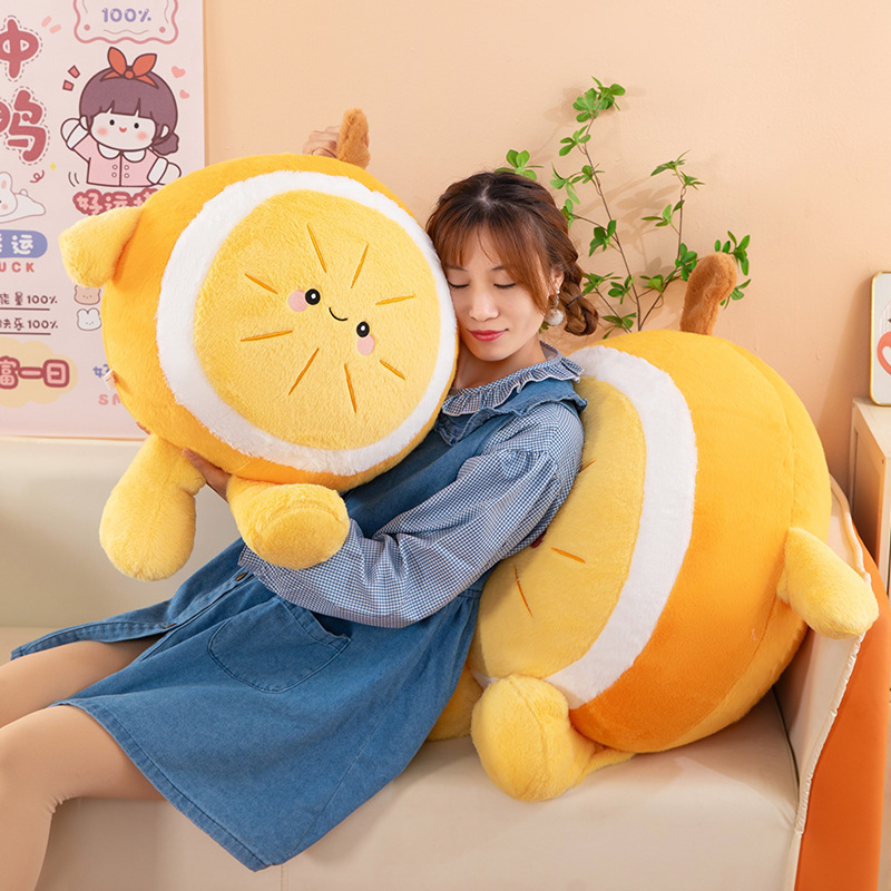 Orange plush pillow with a smiling face used as a soft cushion for hugging on a sofa, cozy and comfortable for relaxing or resting at home