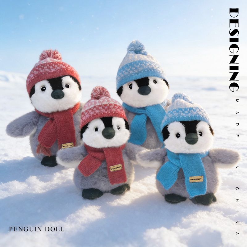 Winter penguin plush toys with hat and scarf standing on snow cute soft stuffed animals outdoor winter scene