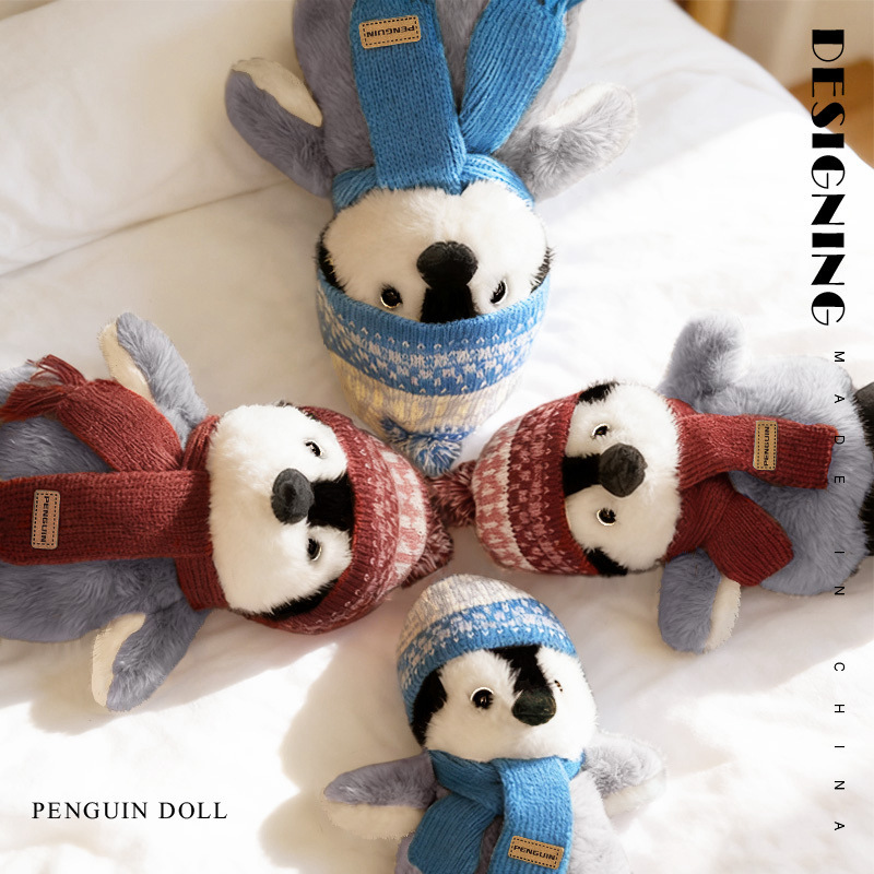 Cute winter penguin plush toys lying on bed with hat and scarf soft stuffed animals cozy indoor display