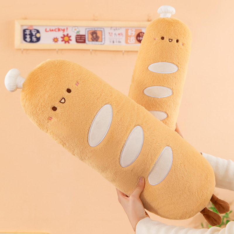 Chef baguette plush pillow held in hands, soft long body cushion with plush fabric texture, ideal for hugging and everyday comfort