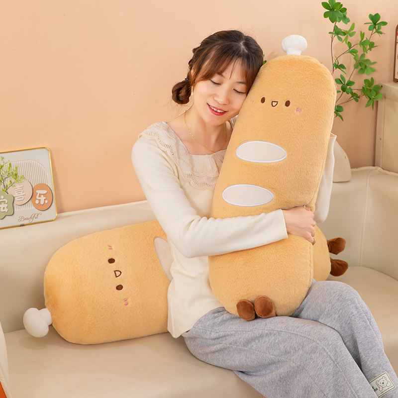 Chef baguette plush pillow used as a hugging body pillow on a sofa, soft long cushion for relaxing, lounging, and adding a cozy touch to home decor