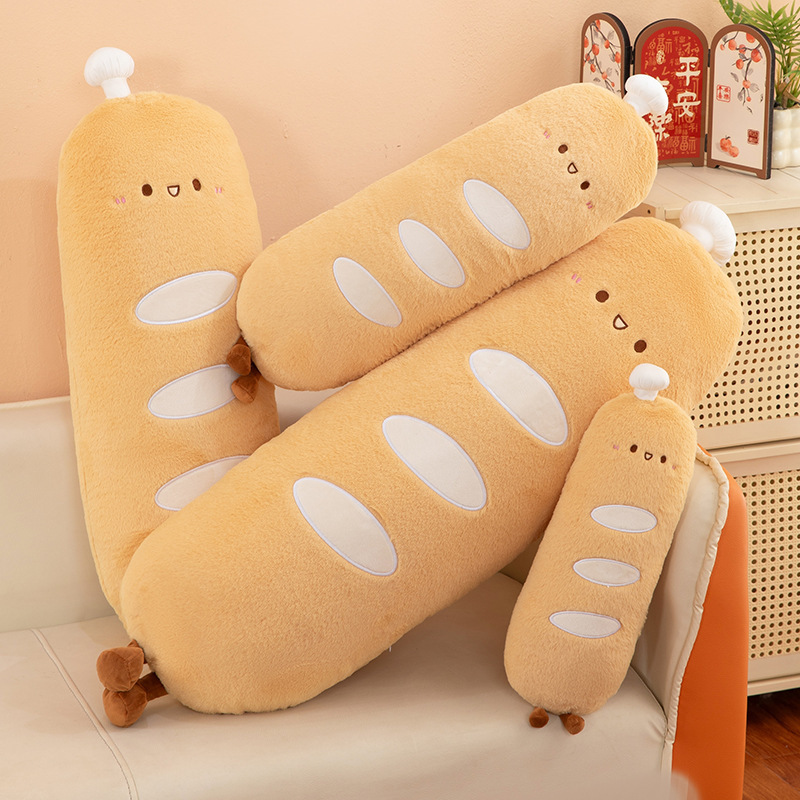 Chef baguette plush pillow arranged casually on a sofa, soft long body cushions in a cozy home setting for relaxing and decor