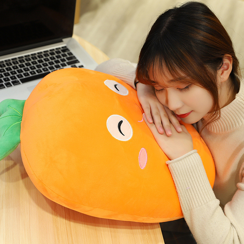 Carrot plush pillow used as a soft cushion for resting on desk, comfortable support for short naps and relaxation