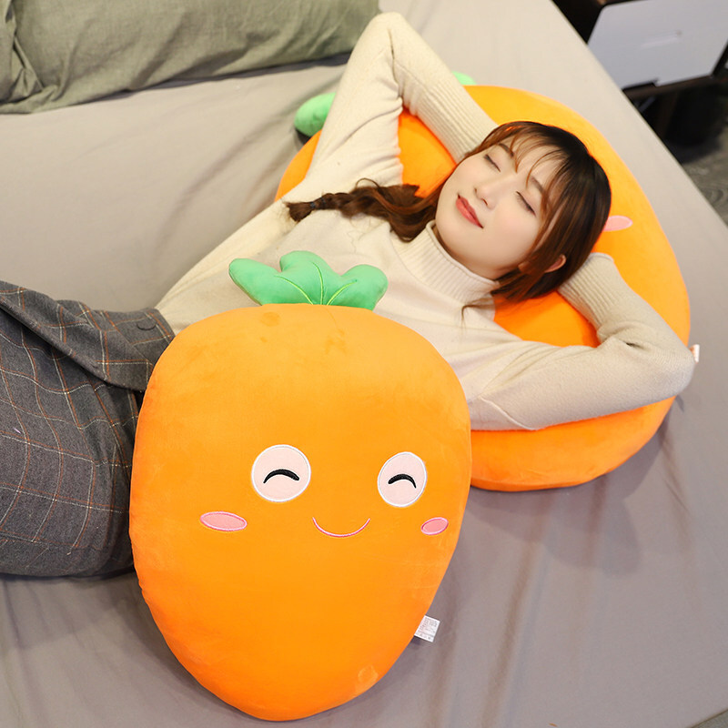 Carrot plush pillow used for lounging and resting, soft plush cushion providing comfort for relaxation and naps on bed