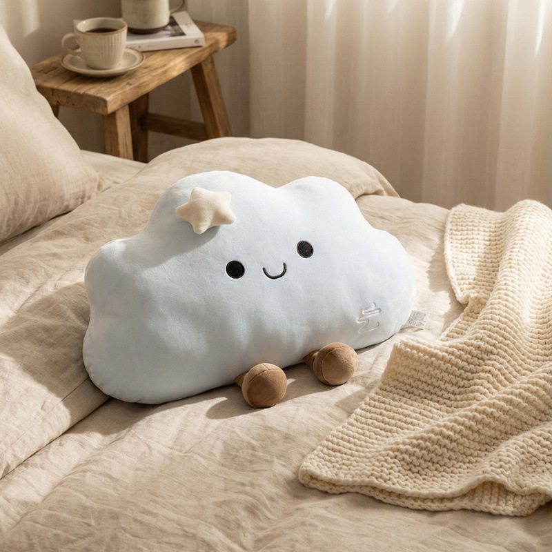 Blue star cloud plush pillow with star detail on bed, soft cloud cushion for cozy bedroom decor