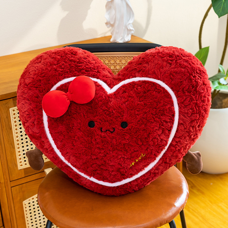 Heart plush pillow on a chair, fluffy red heart-shaped cushion ideal for relaxing, hugging, and home decor styling