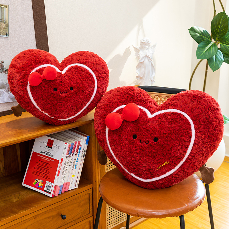 Heart plush pillow on a chair in a cozy living room setting, soft red cushion with cute design for home decor and relaxation