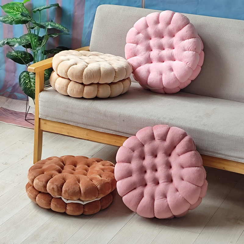 Soft sandwich cookie plush cushion in brown, pink and beige on sofa and floor, cute cushion for seating and home decor