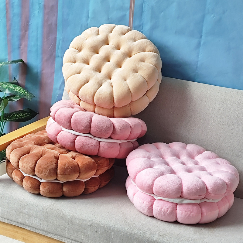 Sandwich cookie plush cushion in beige, pink and brown stacked on sofa, soft floor pillow for cozy home decor