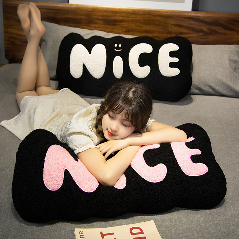 Nice plush pillow black with pink lettering soft long cushion for hugging and resting on bed cozy relaxing comfort