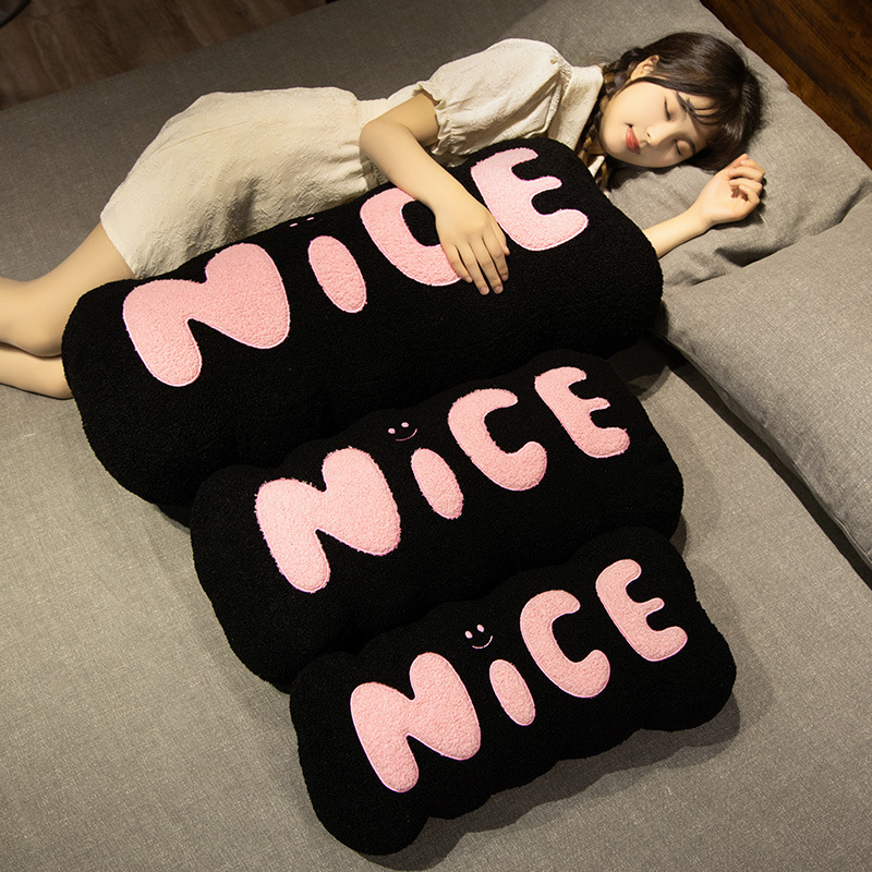 Nice plush pillow soft long cushion for hugging and lounging on bed cozy support for relaxing and restful comfort