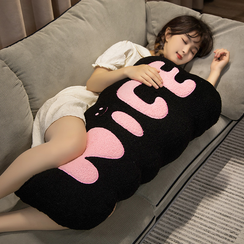 Nice plush pillow black with pink lettering soft long cushion for hugging and lounging on sofa cozy comfort and support