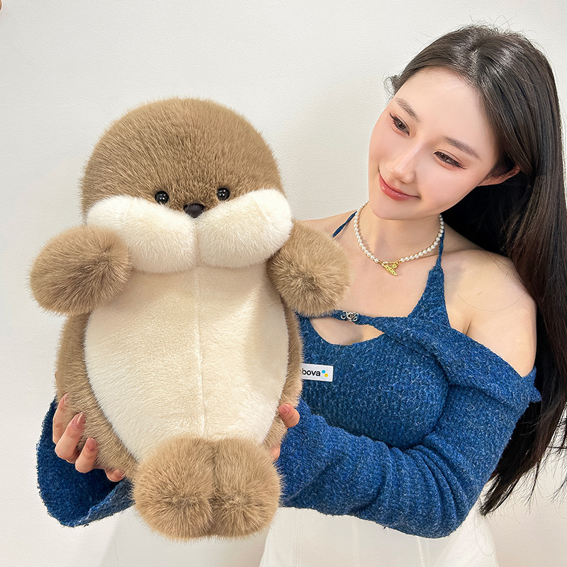 Seal plush toy with rounded body and soft plush fabric, adorable stuffed animal for gifting, decor and cozy spaces