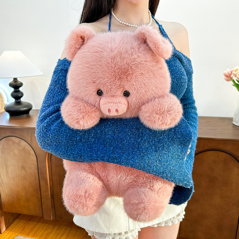 Pig plush toy held close with soft fluffy texture, cute pink stuffed animal for hugging, comfort and cozy home decor
