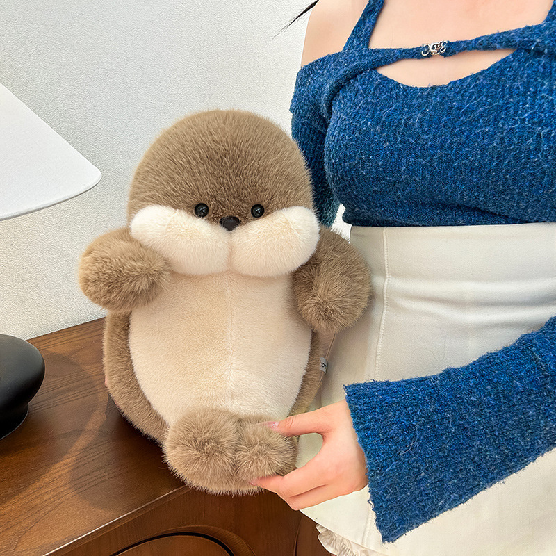 Brown seal plush toy placed on a wooden table, soft fluffy stuffed animal for cozy home decor and everyday comfort