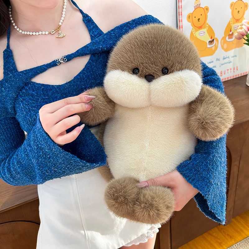 Cute seal plush toy held in arms, soft cuddly stuffed animal perfect for hugging, relaxation and comfort