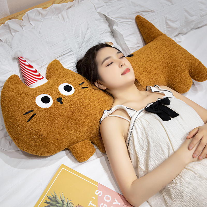 Big-eyed cat plush pillow in brown, long soft cushion providing gentle support for head and neck, ideal for sleeping and cozy bed comfort