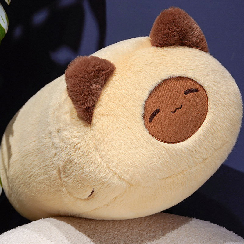 Siamese cat plush pillow close-up showing soft plush fabric, smooth texture, and rounded shape for hugging and everyday comfort