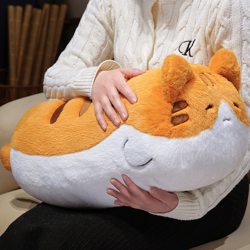 Orange cat plush pillow with fluffy plush texture and chubby design, ideal for hugging, relaxing, and adding warmth to home spaces