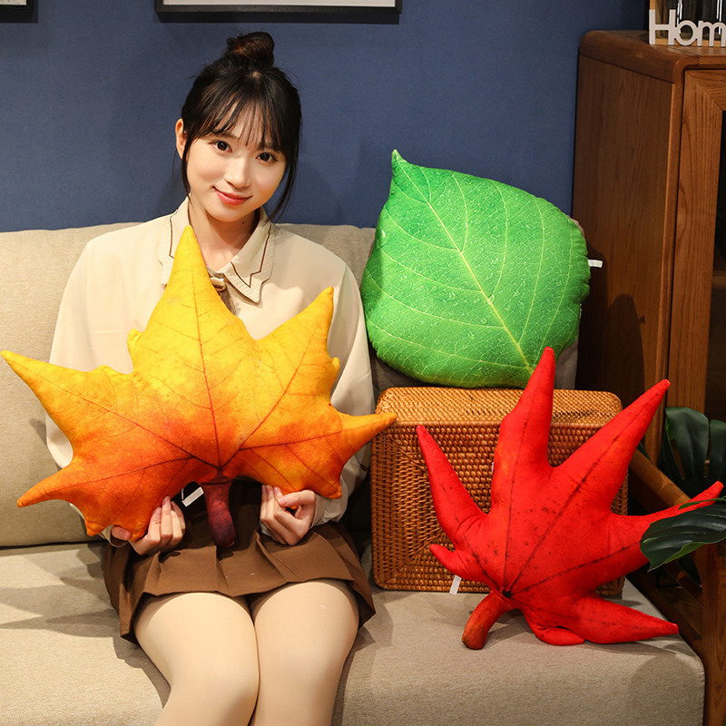 Leaf-shaped plush pillow with detailed veins and vibrant colors, ideal for adding a warm and nature-inspired touch to home decor