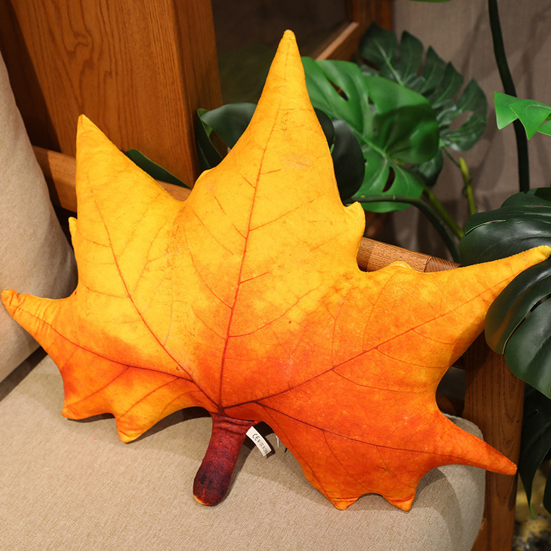 Sycamore leaf plush pillow with orange gradient color and detailed leaf veins, soft and cozy for sofa decor and relaxation