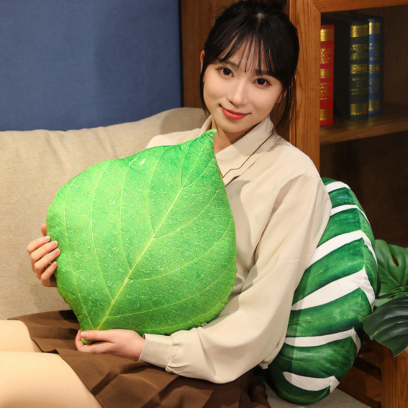 Green leaf plush pillow with realistic leaf veins and soft plush fabric, comfortable for hugging and cozy home decor use