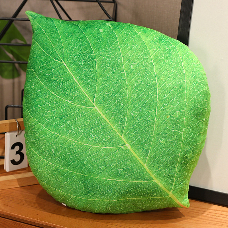 Green leaf plush pillow with realistic vein pattern and soft cushioned feel
