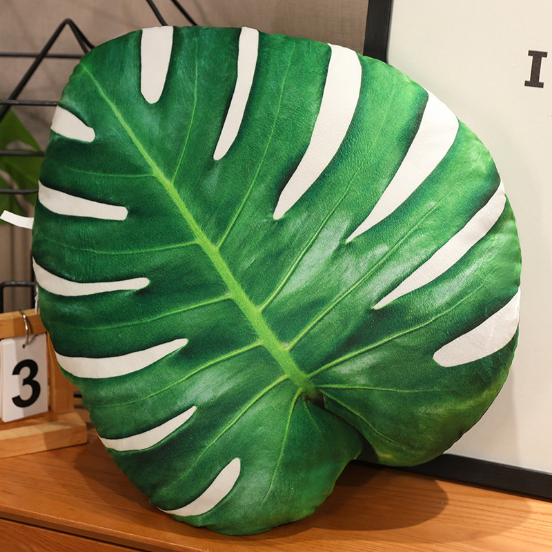 Monstera leaf plush pillow with tropical design and soft plush texture