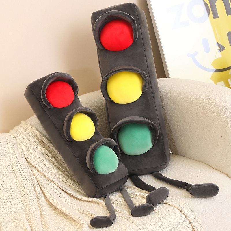 Traffic light plush pillows in two sizes standing on a sofa, long soft cushions with bright signal lights, perfect for hugging lounging and decorating