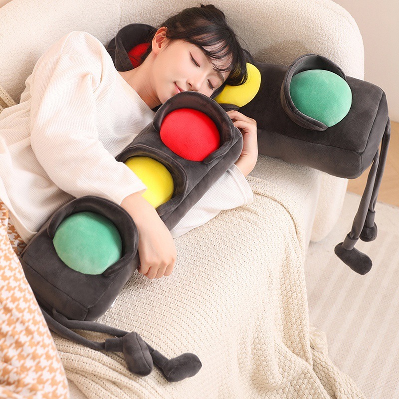 Traffic light plush pillow used for sleeping on a sofa, long soft cushion with red yellow green lights, cozy plush pillow for hugging and naps