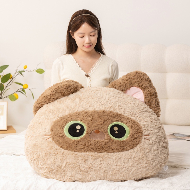 Siamese Cat head plush pillow on bed in soft plush fabric, designed as a supportive backrest cushion for lounging, reading, and everyday comfort