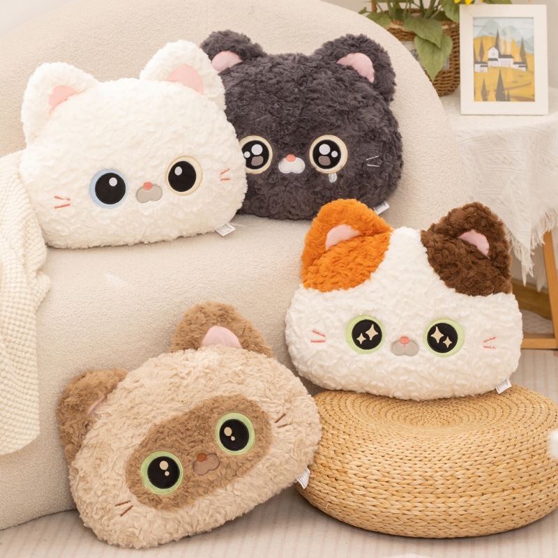Cartoon cat head plush pillow in soft plush fabric displayed on sofa, featuring Calico Cat, Black Devon Rex Cat, and Siamese Cat designs, cozy decorative cushion for home