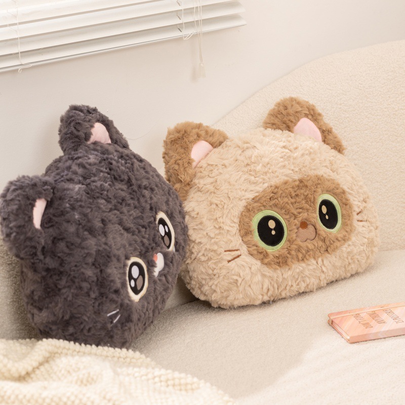 Cartoon cat head plush pillows in Black Devon Rex Cat and Siamese Cat designs placed on sofa, soft decorative cushions for cozy living room setting