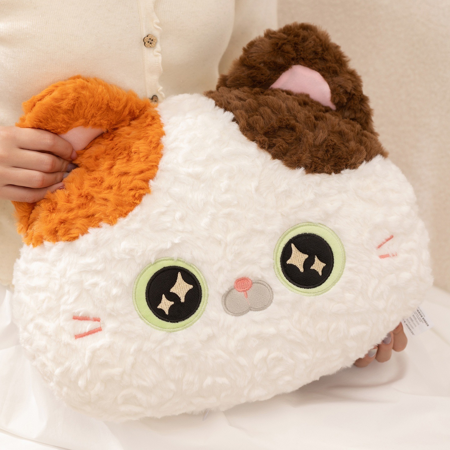 Calico Cat plush pillow close-up showing soft textured plush fabric, embroidered eyes and facial details, fluffy surface for a cozy and comfortable feel