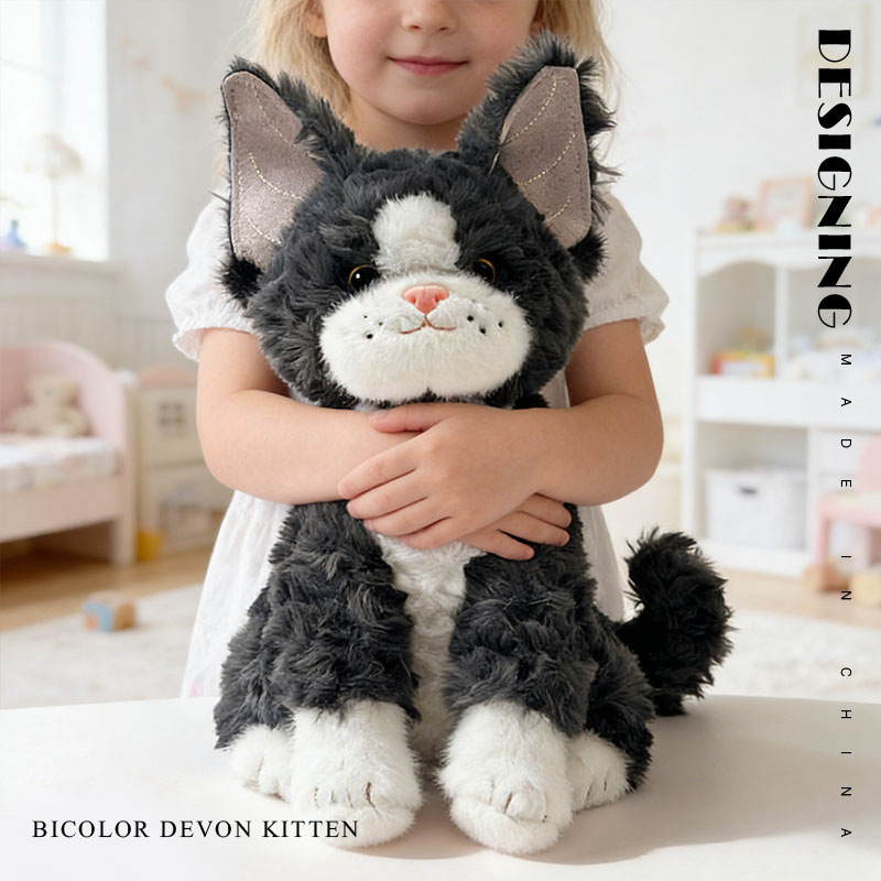 Bicolor Devon Rex cat plush toy with soft fluffy texture and oversized ears, designed for hugging and comfort in a cozy home setting
