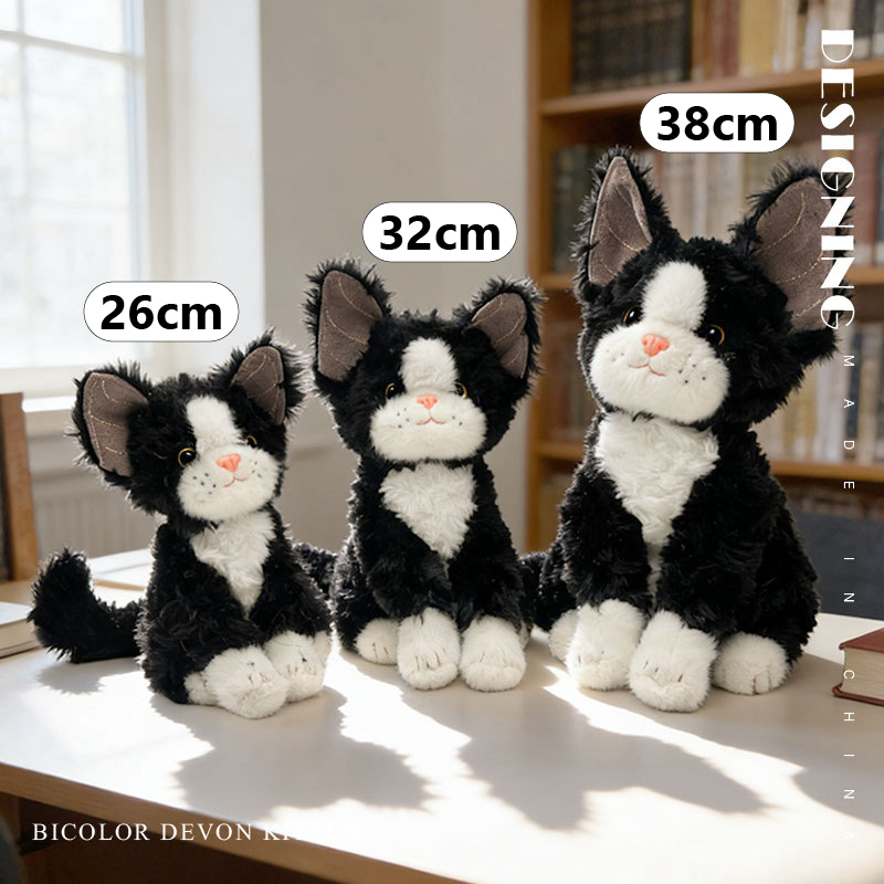 Bicolor Devon Rex cat plush toy size comparison showing 26 cm 32 cm and 38 cm options with soft plush texture and upright sitting design
