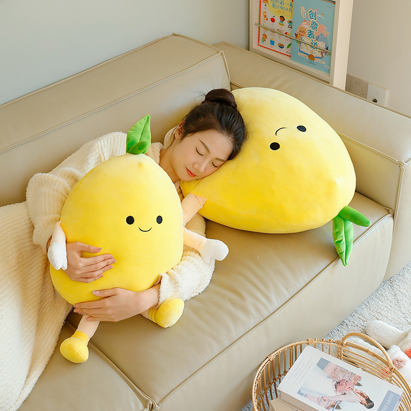 Pomelo plush pillow with plush texture and leaf detail, placed on a sofa for lounging or napping, creating a soft and comfortable resting spot