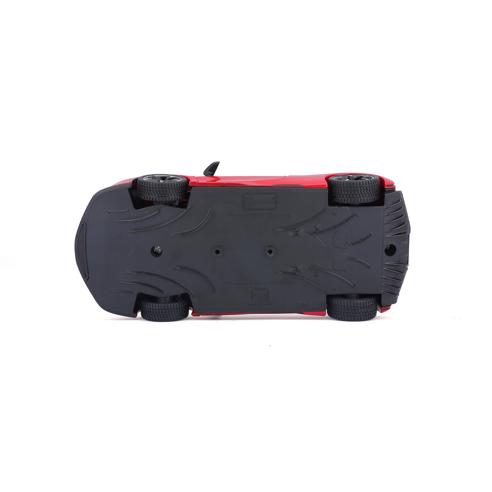 Ferrari SF90 Stradale red 1:24 diecast model car underside view, highlighting molded chassis details and wheel construction