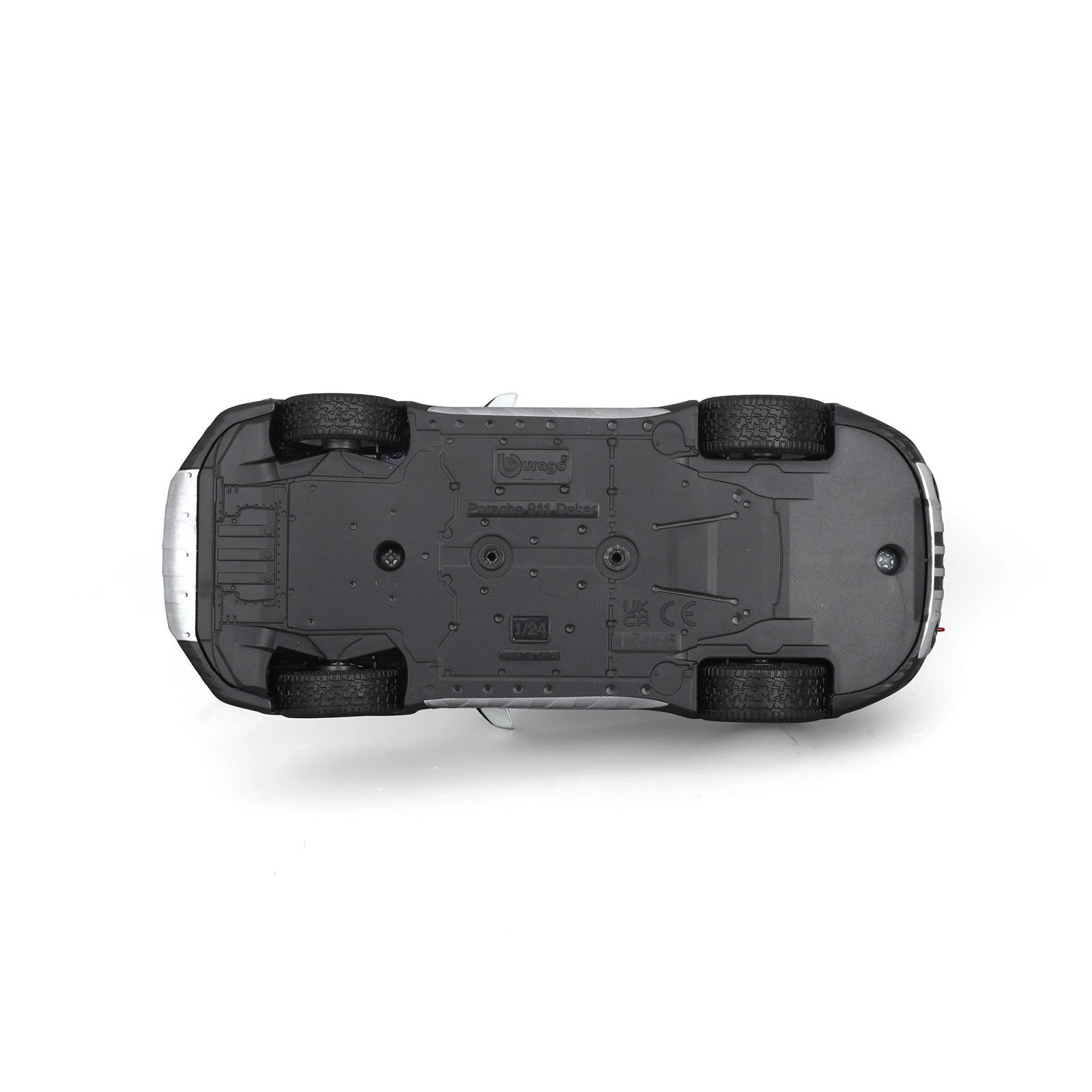 Underside view of Porsche 911 Dakar 1:24 diecast model car with detailed chassis, tire tread pattern, and Bburago branding