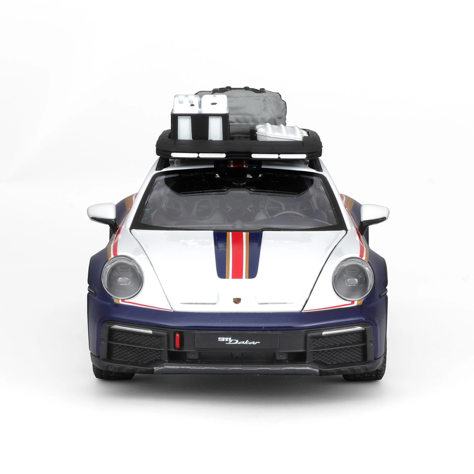 Front view of Porsche 911 Dakar 1:24 diecast model car featuring #953 Dakar rally livery, detailed headlights, grille, and roof rack accessories
