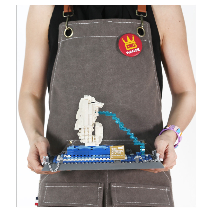 WANGE Merlion Statue Singapore building blocks model displayed in hand, showing scale, detailed structure, blue water effect, and decorative display base