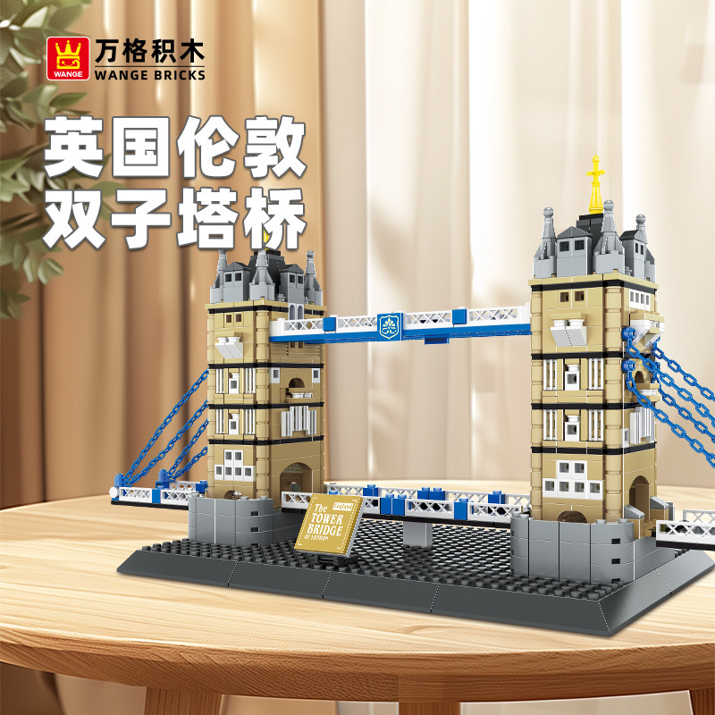 WANGE Tower Bridge London England building blocks model displayed on table, featuring twin towers, blue suspension details, and realistic architectural design in a cozy indoor setting