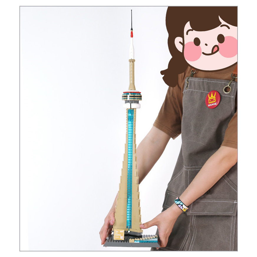 Completed CN Tower building blocks model held for size comparison, highlighting tall structure, observation deck details, and display presence in a clean studio setting
