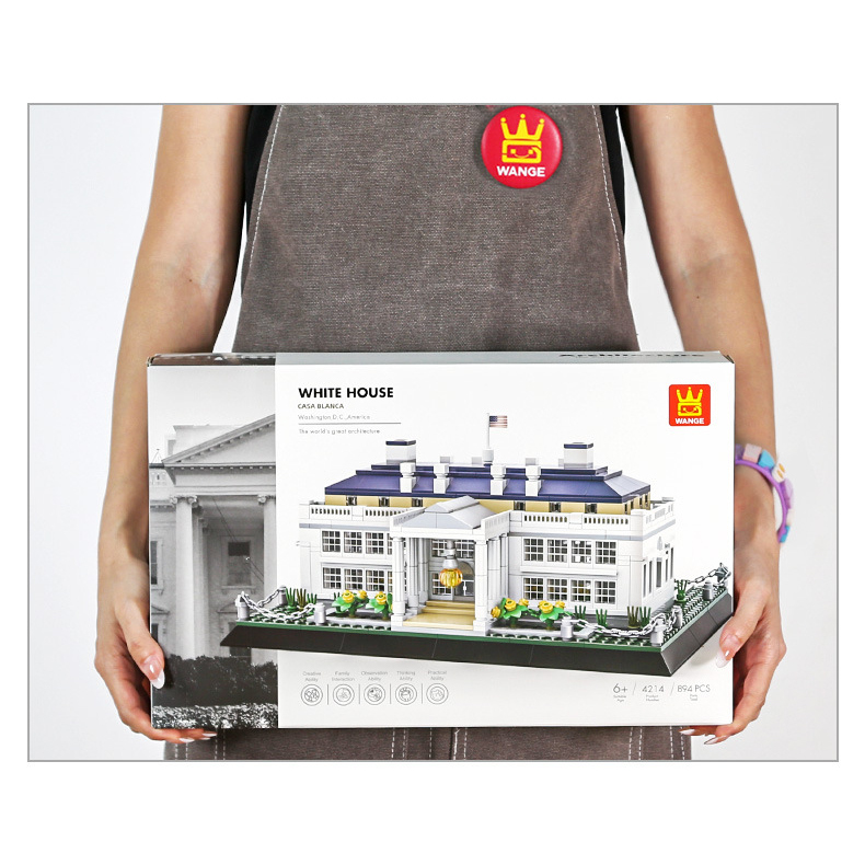 WANGE White House building blocks set packaging shown in hand for size reference, featuring detailed model artwork, piece count, and gift-ready presentation box