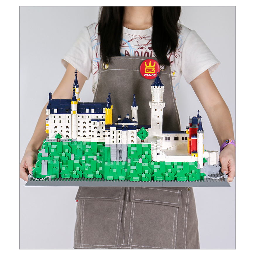 Neuschwanstein Castle building blocks model displayed in scale, showcasing large finished size, detailed towers, layered hillside base, and impressive architectural presence
