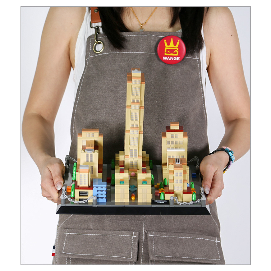 Rockefeller Center New York building blocks model on display base, showcasing central tower, surrounding buildings, and detailed city layout design